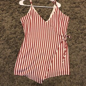 A striped red and white romper dress.